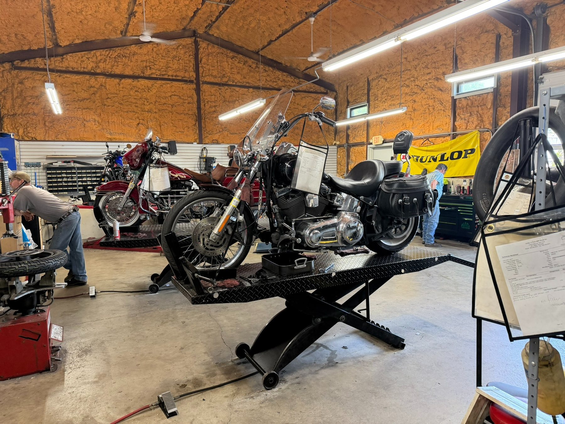 Motorcycles receiving service inside Total Cycle in Rochester, NY